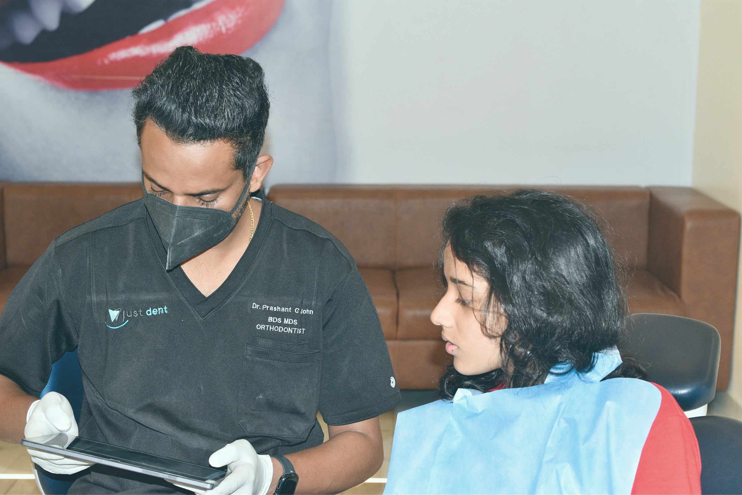 Reviewing a treatment plan with a patient at Just Dent